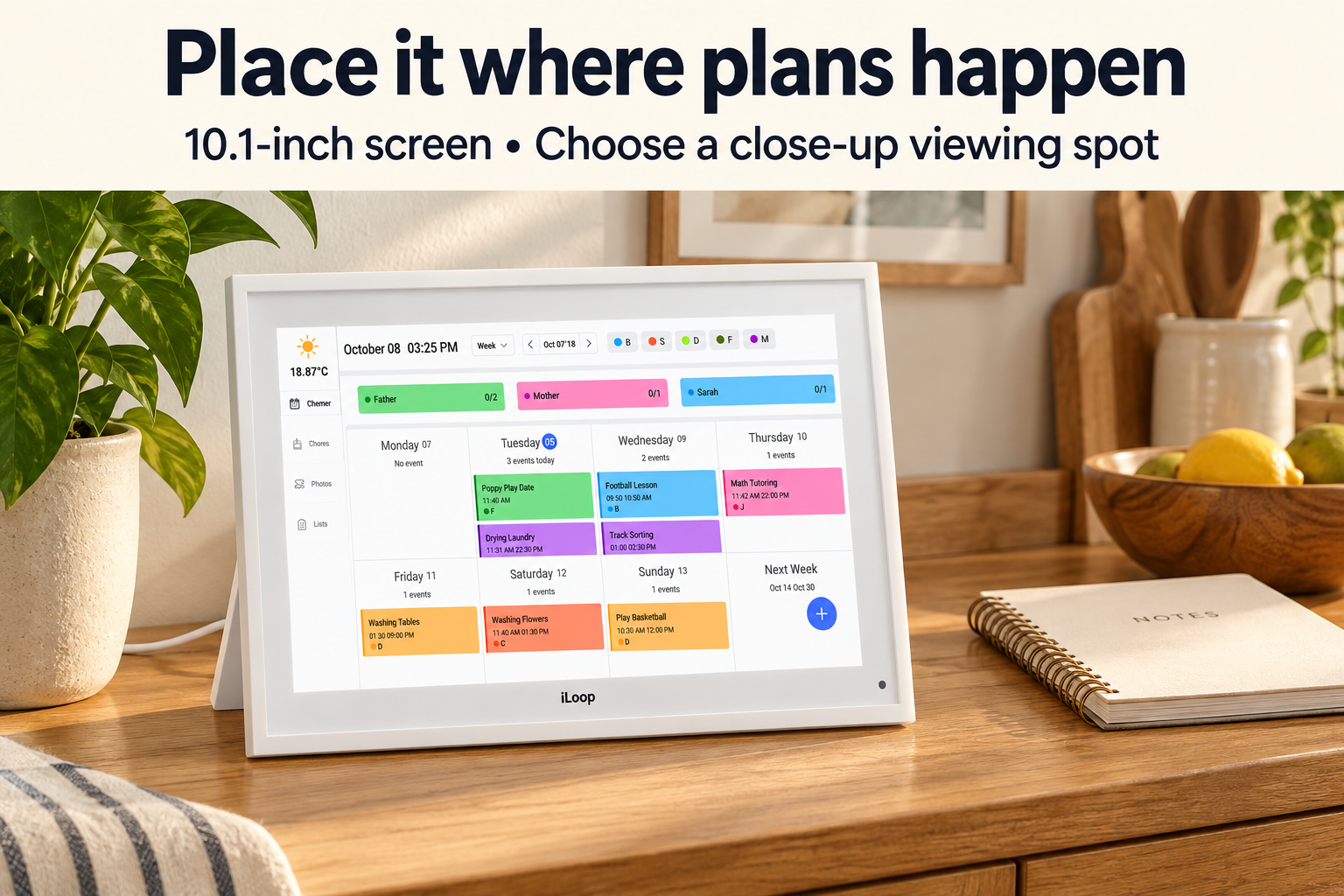 White iLoop calendar supported on a kitchen sideboard beside a notebook, with a close-up viewing reminder.